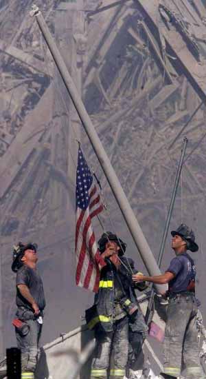 The World Trade Center bombing on September 11th, 2001. Three firefighters raising the American flag in an unforgettable symbol of hope and endurance. (C) 2001 The New Jersey Record (Bergen County, N.J.). Photo by Thomas E. Franklin. GroundZeroSpirit.com.