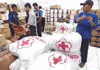 Indonesian Red Cross staff in Jakarta prepare supplies to be conveyed to the tsunami-hit Aceh region. Photo is courtesy of IFRC.